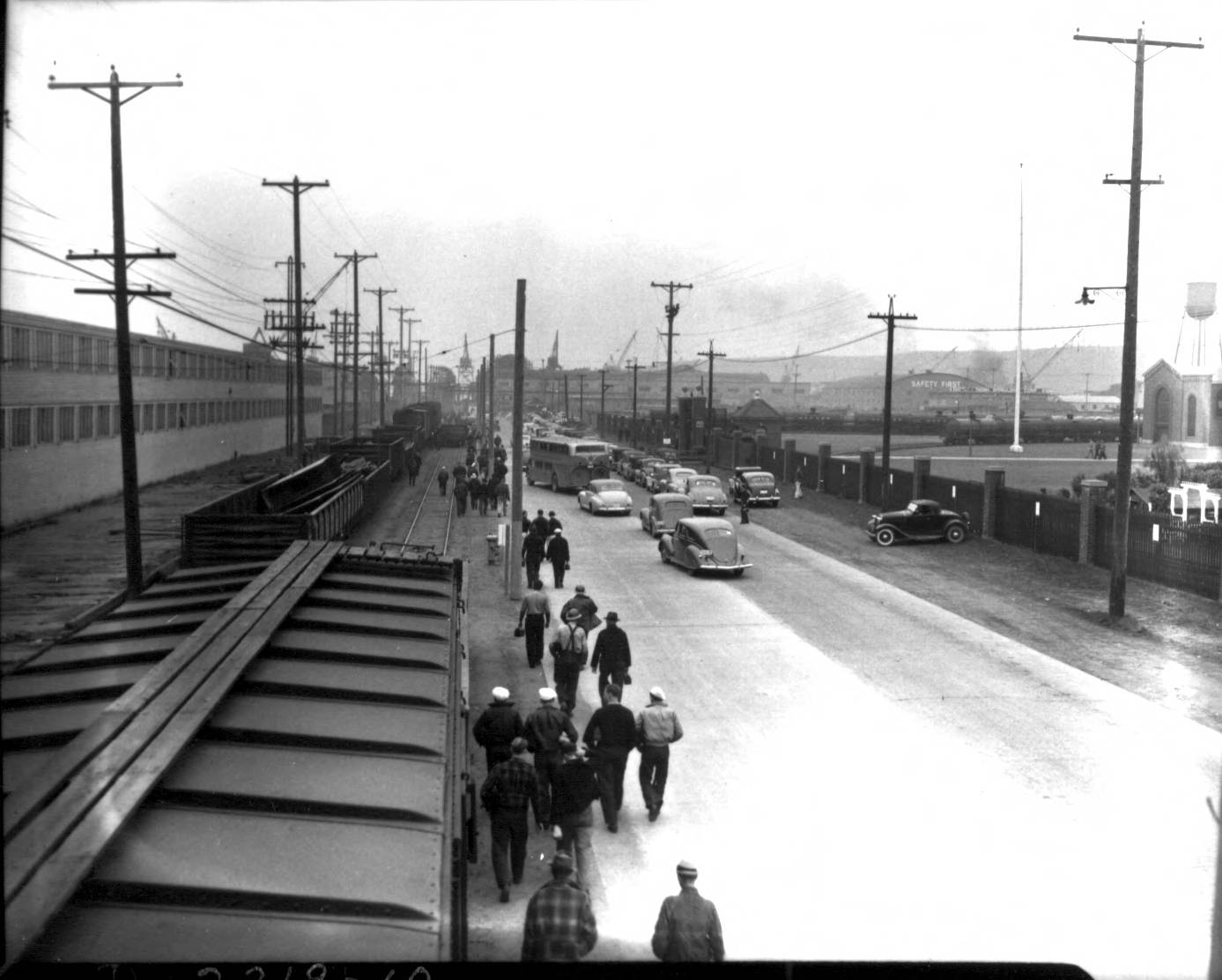 historical photo of people walking on a road